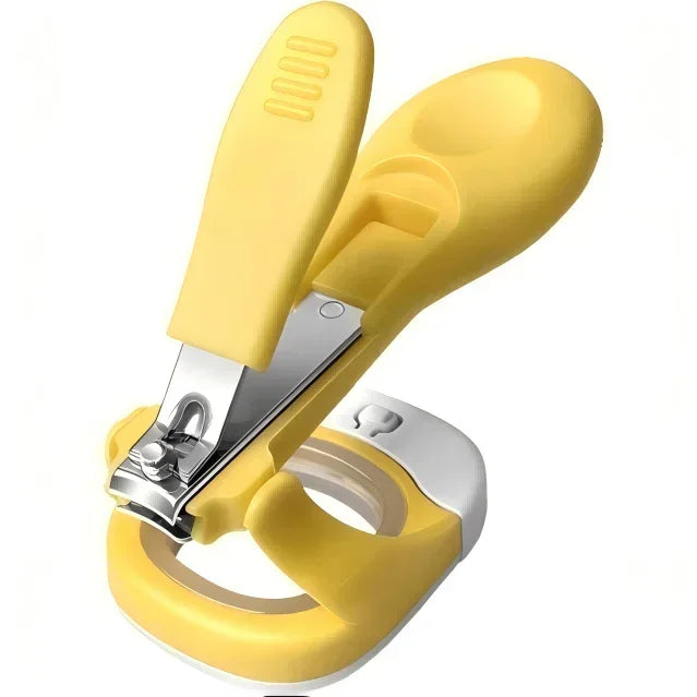 Yellow baby nail clippers with ergonomic handle and safety guard, isolated on white background.
